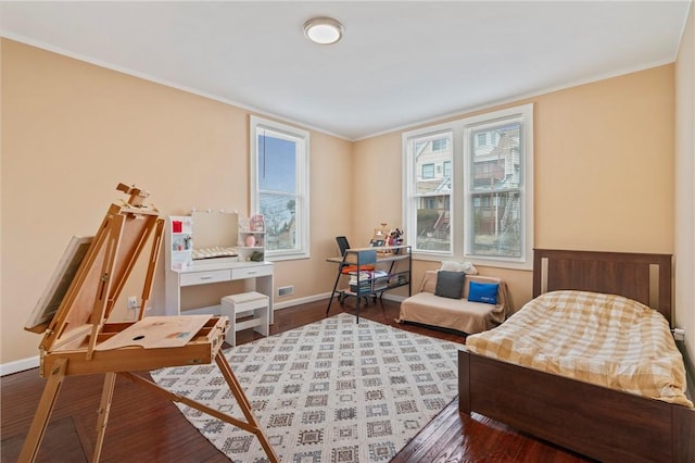 interior space with ornamental molding, multiple windows, wainscoting, and wood finished floors