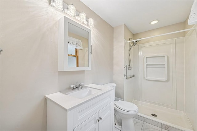 full bath with toilet, a stall shower, marble finish floor, and vanity