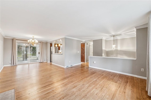 unfurnished living room with ornamental molding, light wood-style flooring, baseboards, and an inviting chandelier