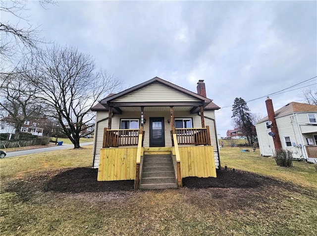 bungalow-style home featuring a porch and a chimney