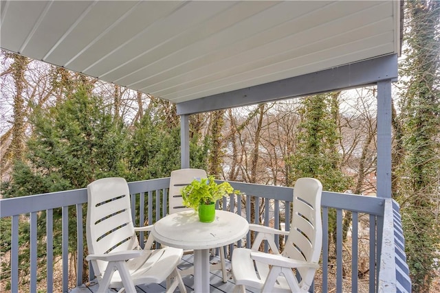 wooden terrace featuring outdoor dining space