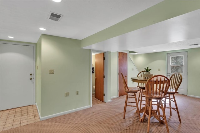 dining area featuring light carpet, baseboards, visible vents, and recessed lighting