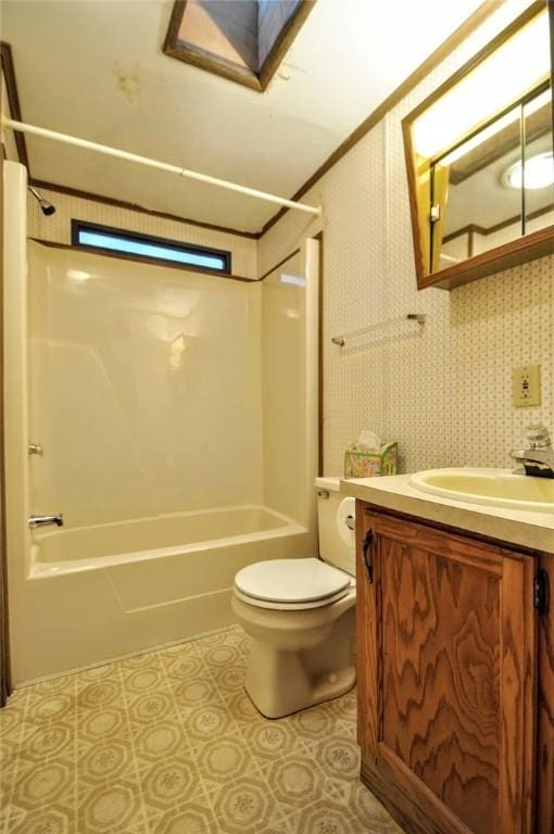 bathroom with tile patterned flooring, vanity, toilet, and shower / bathtub combination