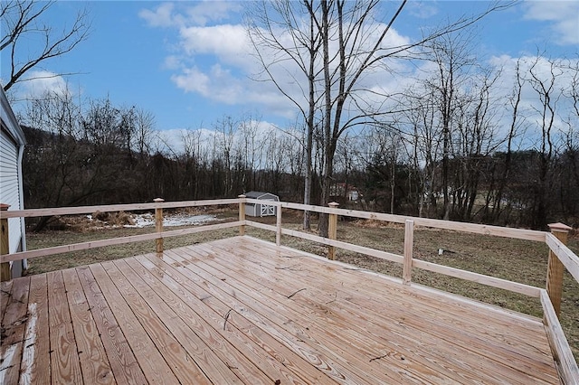 wooden deck featuring a forest view