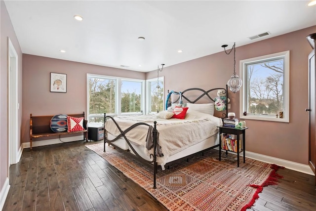 bedroom featuring dark wood-style flooring, recessed lighting, visible vents, and baseboards