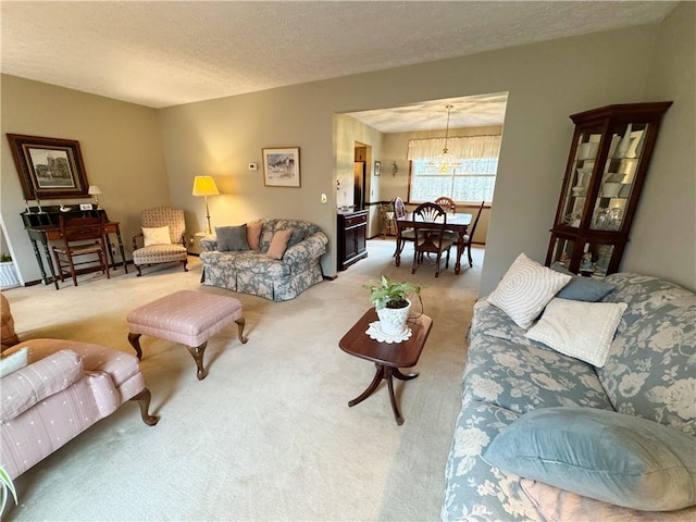 carpeted living room featuring a textured ceiling