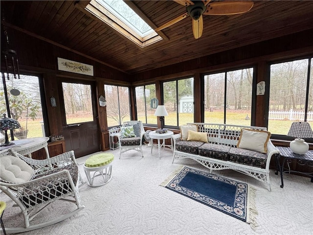 sunroom / solarium with lofted ceiling with skylight and wooden ceiling