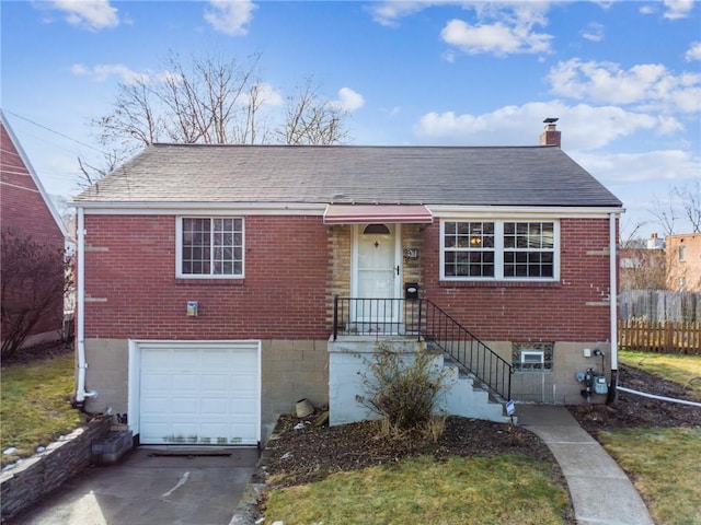 view of front of property with concrete driveway, a chimney, an attached garage, fence, and brick siding