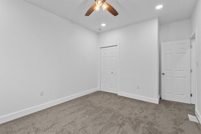 carpeted empty room with ceiling fan, recessed lighting, and baseboards