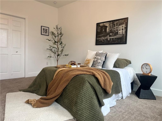 bedroom featuring baseboards and carpet flooring