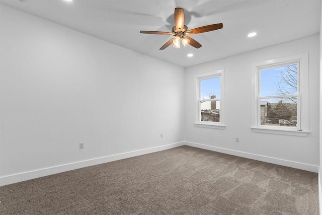 carpeted empty room featuring baseboards, a ceiling fan, and recessed lighting