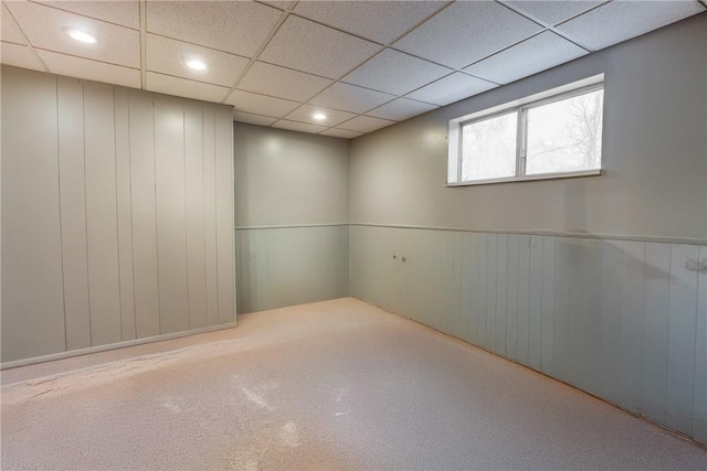 basement featuring a drop ceiling and recessed lighting