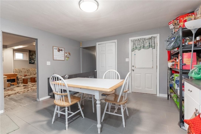 dining space featuring baseboards