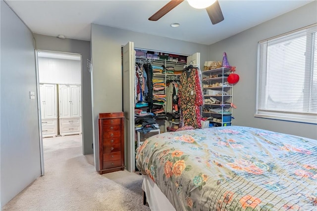 bedroom with carpet floors, a ceiling fan, and a closet