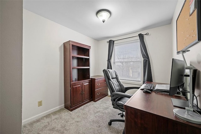 office area with light carpet and baseboards