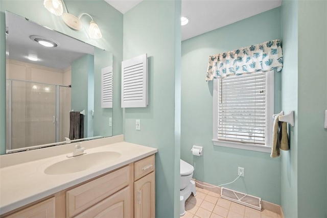 full bathroom featuring toilet, vanity, visible vents, tile patterned floors, and a stall shower