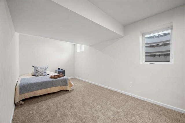 carpeted bedroom with baseboards