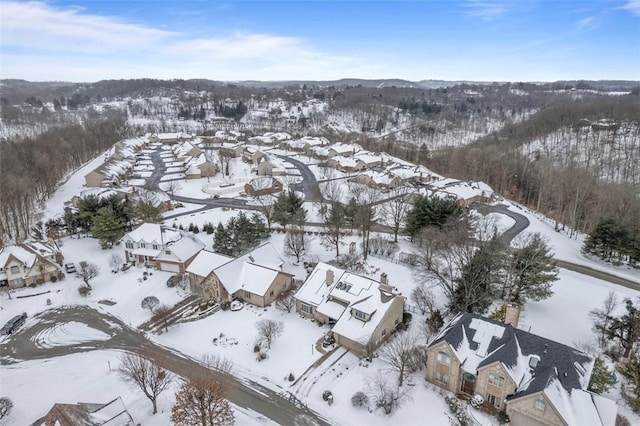 snowy aerial view featuring a residential view