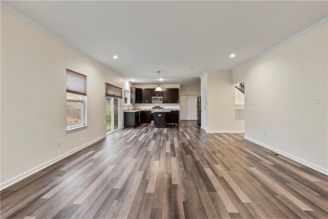 unfurnished living room with ornamental molding and dark wood-style flooring