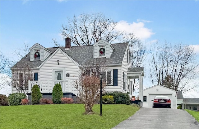 cape cod-style house featuring a garage, an outdoor structure, concrete driveway, roof with shingles, and a front yard