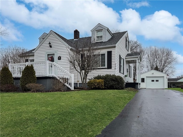 view of front of property with aphalt driveway, a garage, an outdoor structure, a front lawn, and a chimney