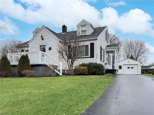 cape cod house featuring an outdoor structure, a detached garage, driveway, a chimney, and a front yard