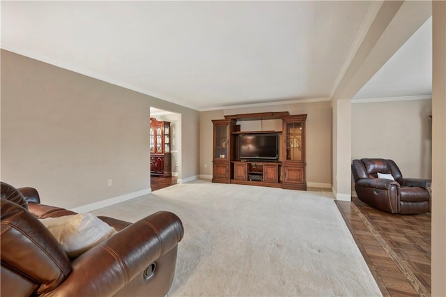 living room with crown molding and baseboards