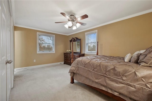 bedroom featuring multiple windows, crown molding, and light carpet