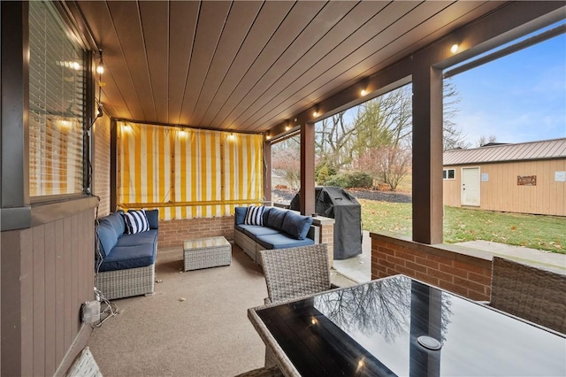 sunroom featuring wood ceiling