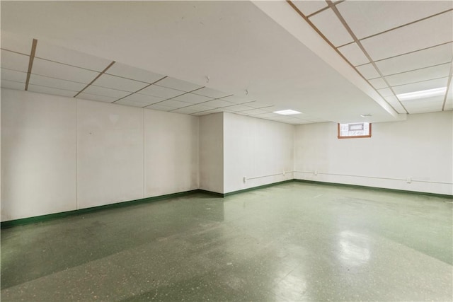 basement featuring a drop ceiling