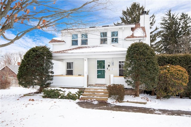 view of front of home with a chimney