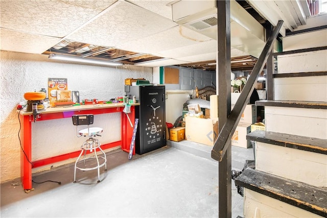 unfinished basement featuring visible vents