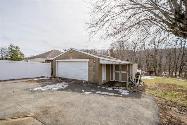 garage with fence