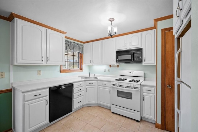 kitchen with light tile patterned floors, black appliances, and white cabinets