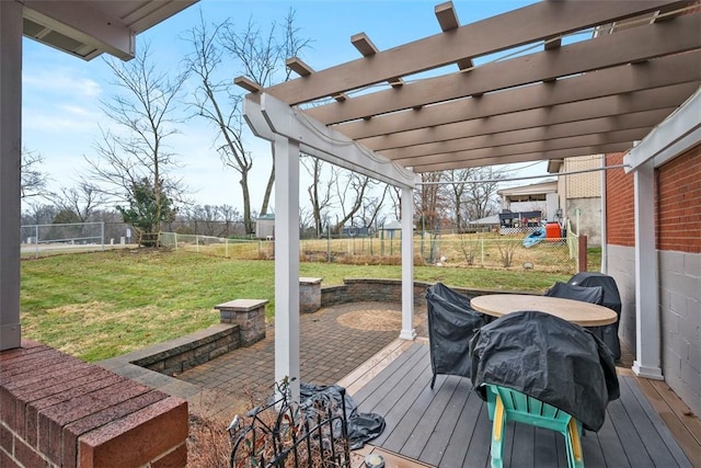 wooden deck with a fenced backyard, a pergola, and a lawn