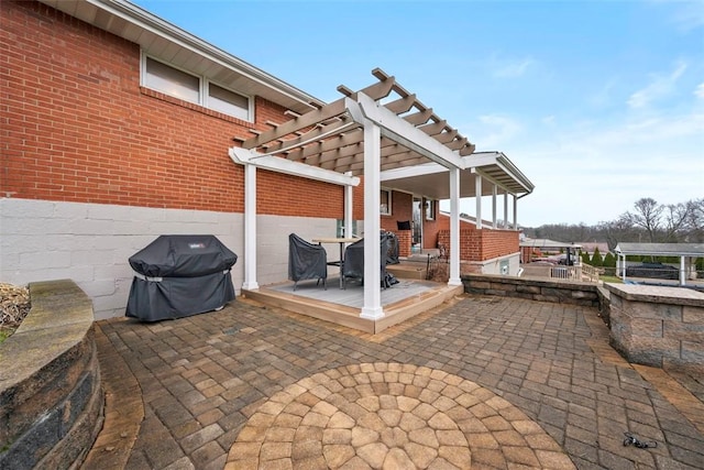 view of patio / terrace featuring a pergola and area for grilling