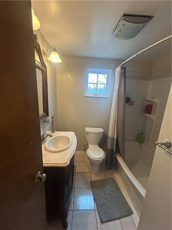 full bathroom featuring tile patterned flooring, shower / bathtub combination with curtain, vanity, and toilet