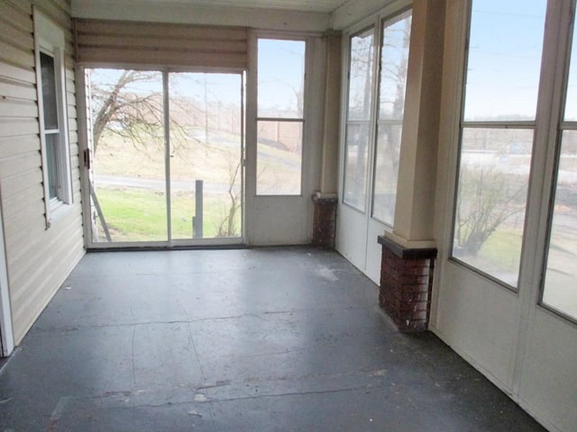 unfurnished sunroom with plenty of natural light