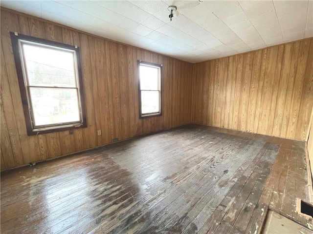 empty room with hardwood / wood-style flooring