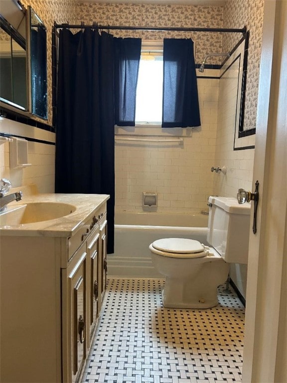 full bathroom featuring shower / bath combo, vanity, and toilet