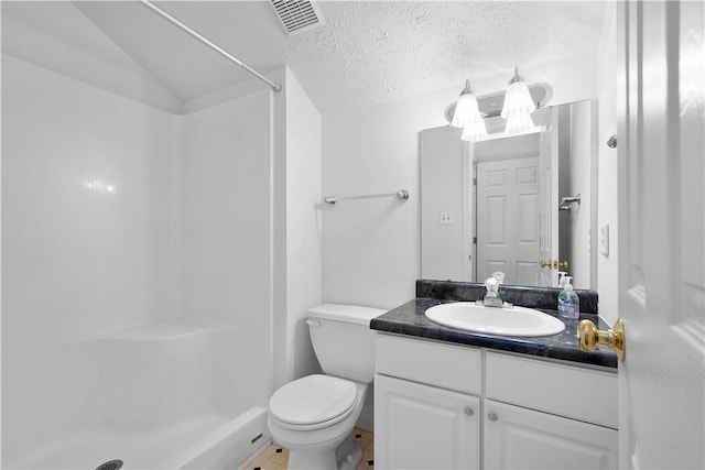 bathroom featuring visible vents, toilet, a textured ceiling, vanity, and a shower stall