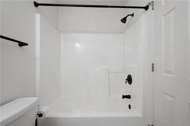 full bathroom featuring shower / tub combination and toilet