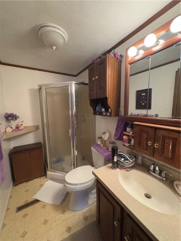 full bath with a stall shower, visible vents, toilet, crown molding, and vanity