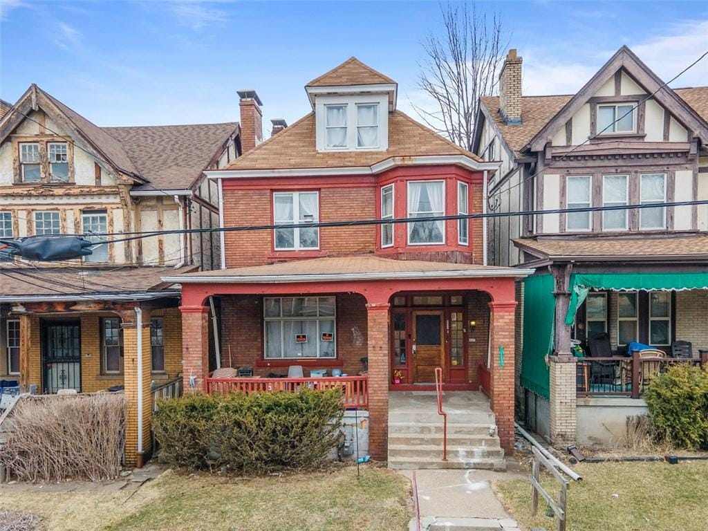507 Holmes St, Wilkinsburg, PA 15221 - view of front of home featuring a porch and brick siding