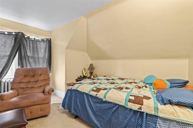 bedroom with carpet, vaulted ceiling, and baseboards