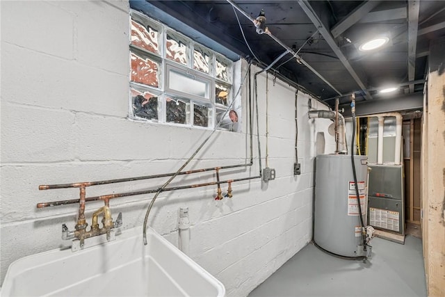 utility room featuring heating unit and gas water heater