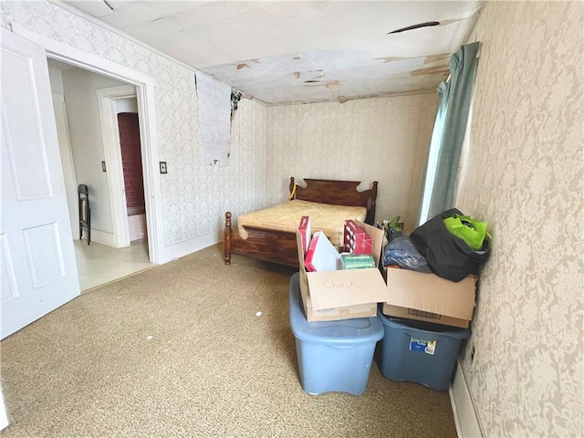 bedroom with baseboards and wallpapered walls