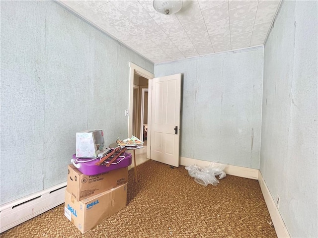 spare room with a baseboard heating unit