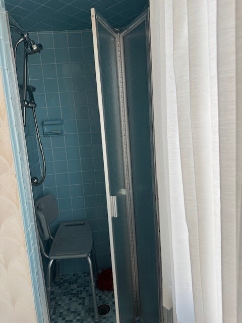 bathroom featuring a stall shower and tile patterned flooring