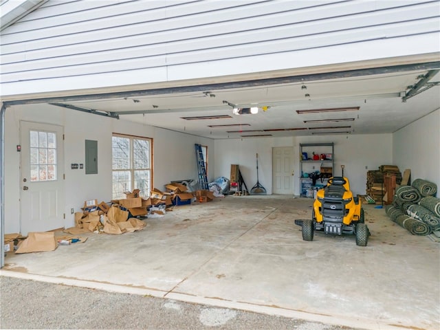 garage featuring electric panel and a garage door opener